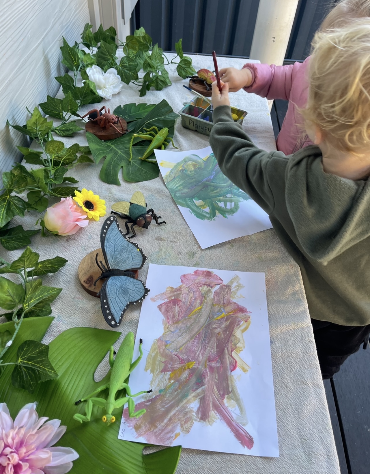 Child engaged in creative exploration in the Koala Room
